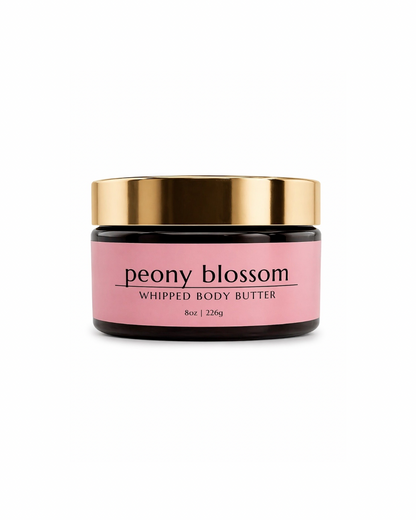 A jar of whipped body butter labeled "peony blossom," on white background. Floral