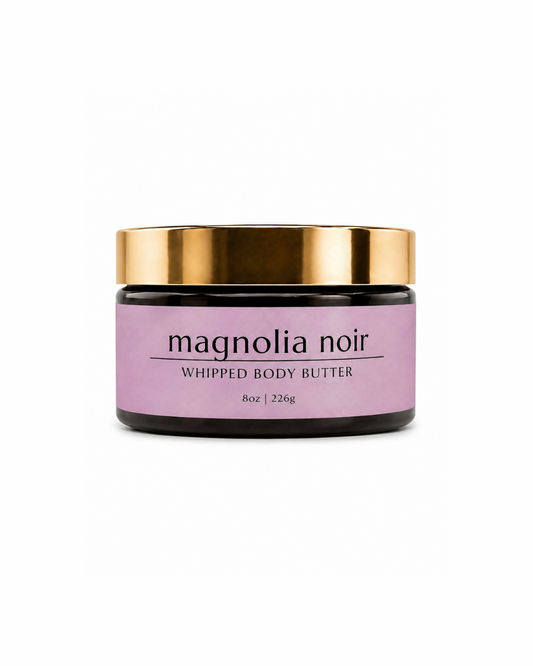 Jar of magnolia noir whipped body butter with gold lid on a white background
